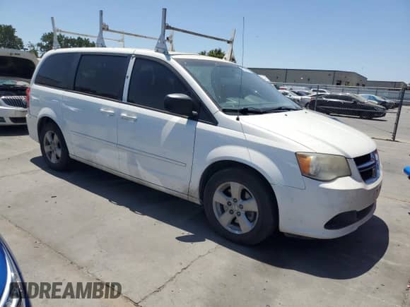 2013 Dodge Grand Caravan American Value with VIN 2C4RDGBG5DR516901, listed as a Copart auction lot 63338975 with 230,644 mi miles and Clean title. Bid and sale history available at DreamBid. Image 4.