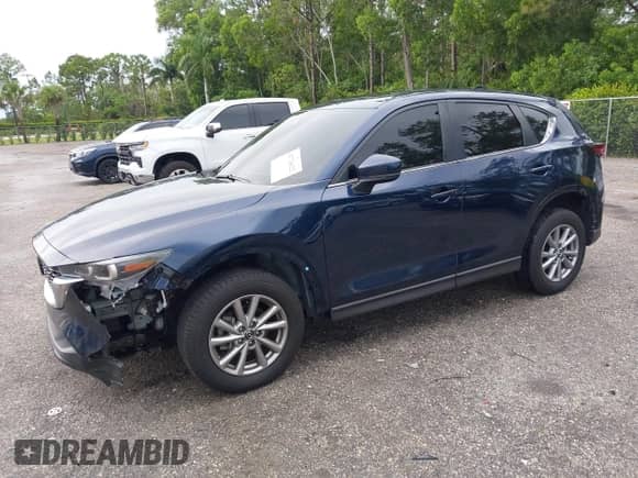 2023 Mazda CX-5 S Preferred z VIN JM3KFBCMXP0209359, wystawiony jako IAAI lot #42724622 z przebiegiem 14 682 mil mil oraz . Historia ofert i sprzedaży dostępna na DreamBid. Obrazek 2.