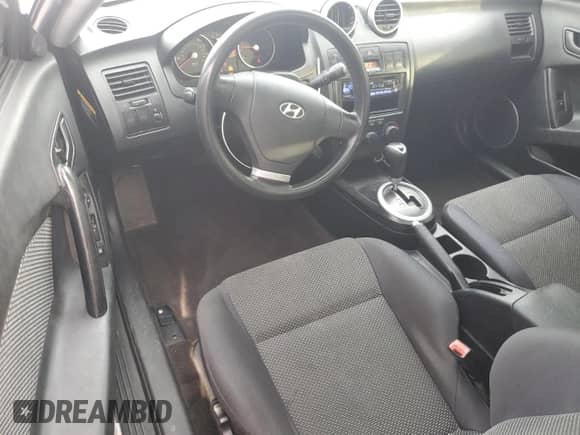 2005 Hyundai Tiburon GS with VIN KMHHM65D35U184724, listed as a Copart auction lot 84444495 with 203,238 mi miles and Salvage title. Bid and sale history available at DreamBid. Image 8.