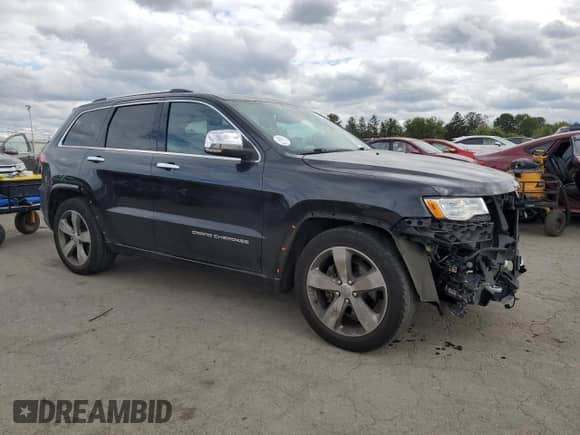 2016 Jeep Grand Cherokee Overland with VIN 1C4RJFCG6GC489769, listed as a Copart auction lot 82302855 with 136,225 mi miles and Salvage title. Bid and sale history available at DreamBid. Image 4.