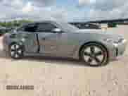 2024 BMW i4 eDrive35 with VIN WBY43AW06RFS76231, listed as a Copart auction lot 67096505 with 35,487 mi miles and Salvage title. Bid and sale history available at DreamBid. Image 4.