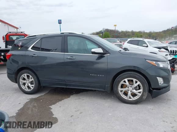 2021 Chevrolet Equinox Premier with VIN 2GNAXNEV9M6140537, listed as a IAAI auction lot 42016514 with 52,237 mi miles and . Bid and sale history available at DreamBid. Image 13.
