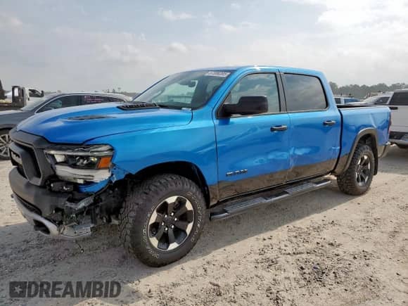 2024 Ram 1500 Rebel z VIN 1C6SRFLT2RN122227, wystawiony jako Copart lot #57086395 z przebiegiem 23 705 mil mil oraz Szkoda całkowita • Salvage title. Historia ofert i sprzedaży dostępna na DreamBid. Obrazek 1.