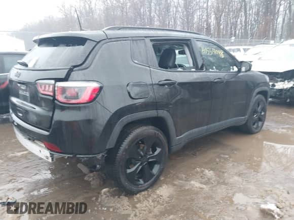 2020 Jeep Compass Latitude with VIN 3C4NJCBB5LT166329, listed as a IAAI auction lot 41554098 with 59,853 mi miles and . Bid and sale history available at DreamBid. Image 4.