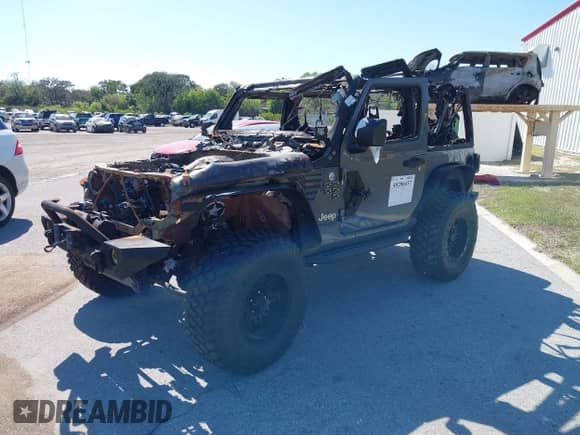 2020 Jeep Wrangler Sport S with VIN 1C4GJXAG6LW189187, listed as a IAAI auction lot 40280437 with Not provided miles and . Bid and sale history available at DreamBid. Image 2.