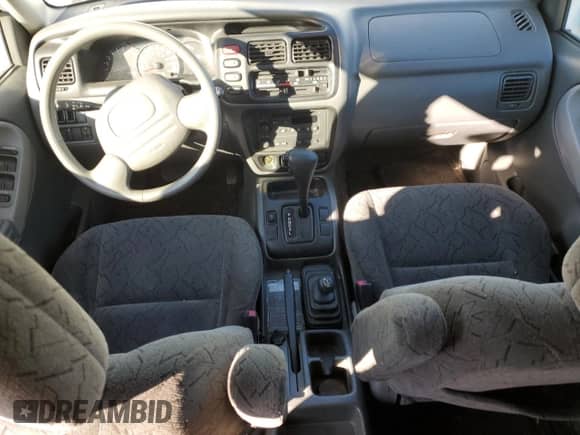 2004 Chevrolet Tracker LT with VIN 2CNBJ634446905809, listed as a Copart auction lot 42042875 with 130,984 mi miles and Salvage title. Bid and sale history available at DreamBid. Image 8.