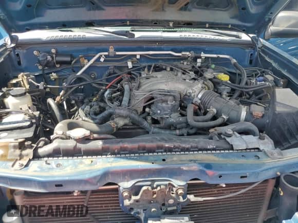 2004 Nissan Frontier XE z VIN 1N6ED29X14C435973, wystawiony jako Copart lot #82574885 z przebiegiem 170 442 mil mil oraz Czysty tytuł • Clean title. Historia ofert i sprzedaży dostępna na DreamBid. Obrazek 11.