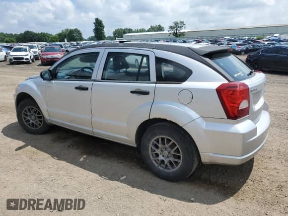 2009 Dodge Caliber SE with VIN 1B3HB28A59D161361, listed as a Copart auction lot 64144715 with 173,288 mi miles and Clean title. Bid and sale history available at DreamBid. Image 2.