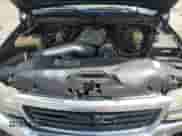 2005 GMC Sierra 1500 SLE z VIN 2GTEK13T751200347, wystawiony jako Copart lot #60863495 z przebiegiem 272 891 mil mil oraz Czysty tytuł • Clean title. Historia ofert i sprzedaży dostępna na DreamBid. Obrazek 11.