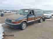 1991 Dodge Grand Caravan with VIN 1B4GK54R4MX558183, listed as a IAAI auction lot 41604086 with 210,400 mi miles and . Bid and sale history available at DreamBid. Image 2.