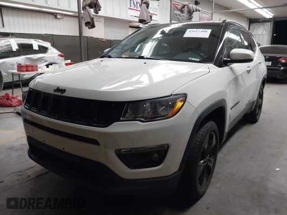 2019 Jeep Compass Latitude with VIN 3C4NJDBB7KT754348, listed as a IAAI auction lot 42617408 with 59,670 mi miles and . Bid and sale history available at DreamBid. Image 2.