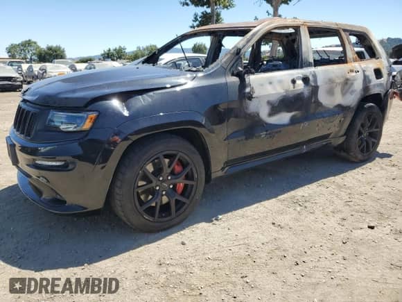 2016 Jeep Grand Cherokee SRT with VIN 1C4RJFDJ0GC468877, listed as a Copart auction lot 64216185 with Not provided miles and Non repairable. Bid and sale history available at DreamBid. Image 1.