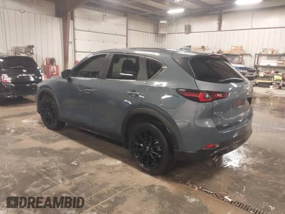 2022 Mazda CX-5 S Carbon Edition z VIN JM3KFBCM3N0527885, wystawiony jako IAAI lot #41226356 z przebiegiem 25 691 mil mil oraz . Historia ofert i sprzedaży dostępna na DreamBid. Obrazek 3.