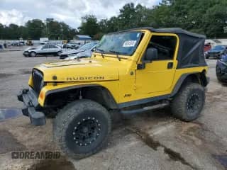 2004 Jeep Wrangler Rubicon with VIN 1J4FA69S84P779864, listed as a Copart auction lot 66345245 with 179,306 mi miles and Salvage title. Bid and sale history available at DreamBid. Image 1.