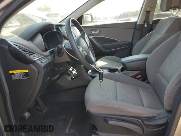 2016 Hyundai Santa Fe with VIN 5XYZTDLB9GG374517, listed as a Copart auction lot 70869645 with 63,795 mi miles and Salvage title. Bid and sale history available at DreamBid. Image 7.