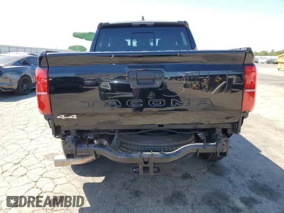 2024 Toyota Tacoma SR5 with VIN 3TMLB5JNXRM054298, listed as a Copart auction lot 66528135 with 5,976 mi miles and Salvage title. Bid and sale history available at DreamBid. Image 6.