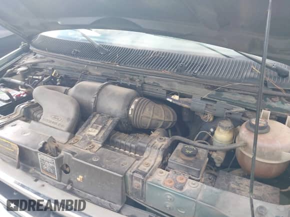 2000 Ford Econoline Cargo with VIN 1FTRE14W8YHB06853, listed as a IAAI auction lot 43410530 with 215,864 mi miles and . Bid and sale history available at DreamBid. Image 10.