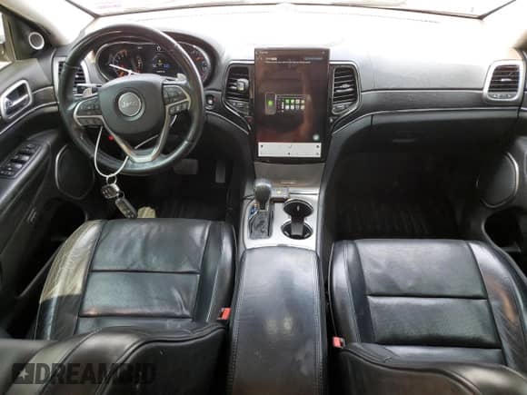 2017 Jeep Grand Cherokee Summit with VIN 1C4RJFJT2HC799869, listed as a Copart auction lot 60662245 with 133,672 mi miles and Salvage title. Bid and sale history available at DreamBid. Image 8.