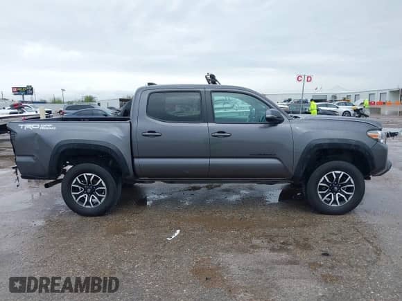 2021 Toyota Tacoma SR5 с VIN 5TFAZ5CNXMX097509, выставлен на аукционе IAAI как лот 41889399 с пробегом 81 598 миль миль и . История ставок и продаж доступна на DreamBid. Изображение 14.