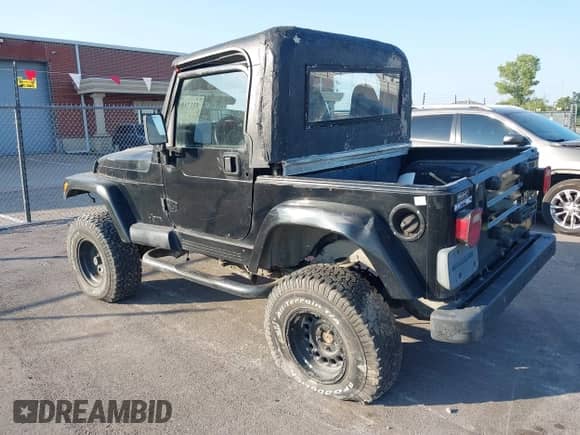 2001 Jeep Wrangler Sport z VIN 1J4FA49S51P352240, wystawiony jako IAAI lot #43492638 z przebiegiem Nie podano mil oraz . Historia ofert i sprzedaży dostępna na DreamBid. Obrazek 3.