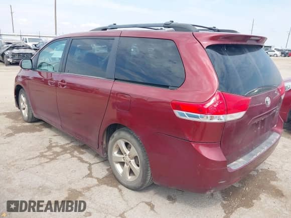 2014 Toyota Sienna LE AAS with VIN 5TDKK3DC2ES491717, listed as a IAAI auction lot 43056857 with 214,762 mi miles and . Bid and sale history available at DreamBid. Image 3.