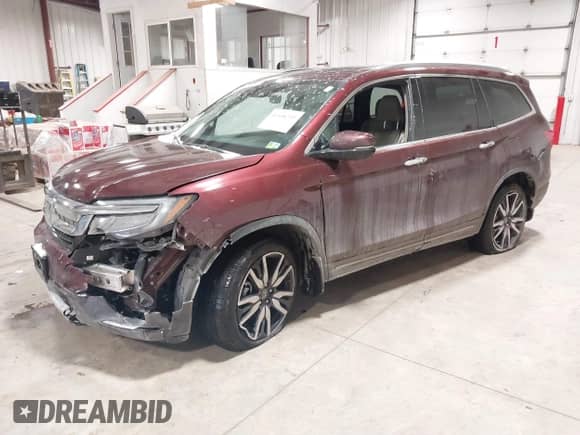 2021 Honda Pilot Touring 7-Passenger z VIN 5FNYF6H61MB044707, wystawiony jako IAAI lot #41548250 z przebiegiem 77 147 mil mil oraz . Historia ofert i sprzedaży dostępna na DreamBid. Obrazek 2.