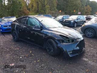 2023 Tesla Model Y Long Range with VIN 7SAYGAEE1PF914992, listed as a IAAI auction lot 43515980 with 5,543 mi miles and . Bid and sale history available at DreamBid. Image 1.