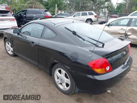 2003 Hyundai Tiburon GT с VIN KMHHN65FX3U087872, выставлен на аукционе IAAI как лот 42607169 с пробегом 196 005 миль миль и . История ставок и продаж доступна на DreamBid. Изображение 3.