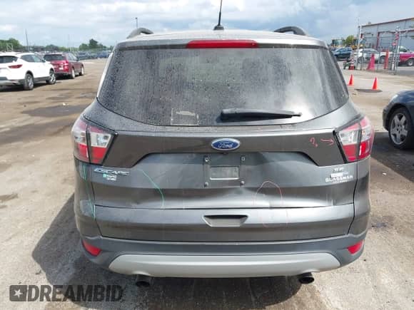 2018 Ford Escape SE z VIN 1FMCU9GD4JUB45420, wystawiony jako IAAI lot #43069540 z przebiegiem 112 884 mil mil oraz . Historia ofert i sprzedaży dostępna na DreamBid. Obrazek 16.
