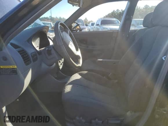 2005 Hyundai Accent GLS с VIN KMHCG45C15U662362, выставлен на аукционе Copart как лот 80574774 с пробегом 122 898 миль миль и Списание • Salvage title. История ставок и продаж доступна на DreamBid. Изображение 7.