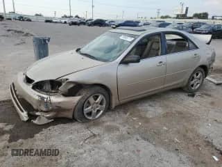 2002 Toyota Camry XLE with VIN 4T1BF32K02U504563, listed as a Copart auction lot 80865775 with Not provided miles and Salvage title. Bid and sale history available at DreamBid. Image 1.