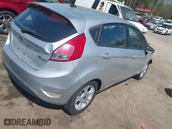 2014 Ford Fiesta S with VIN 3FADP4TJ5EM199405, listed as a IAAI auction lot 41915494 with 127,474 mi miles and . Bid and sale history available at DreamBid. Image 4.