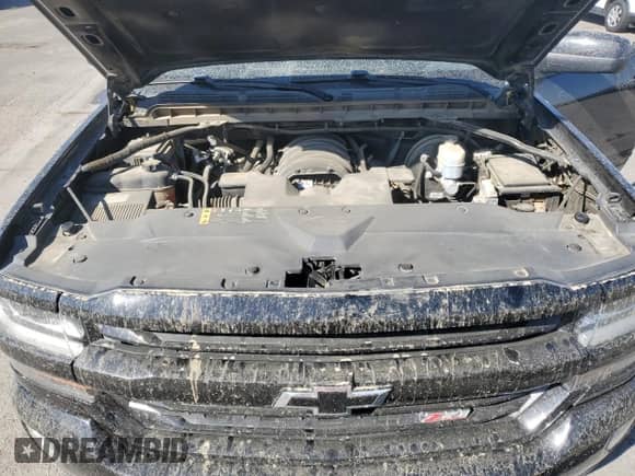 2018 Chevrolet Silverado 1500 LT z VIN 3GCUKREC3JG516403, wystawiony jako Copart lot #82135815 z przebiegiem 138 927 mil mil oraz Szkoda całkowita • Salvage title. Historia ofert i sprzedaży dostępna na DreamBid. Obrazek 11.