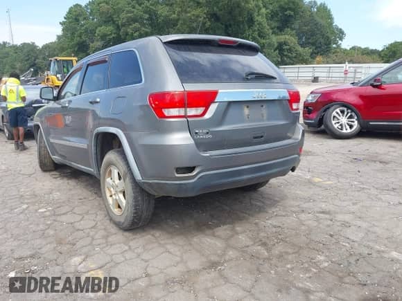 2012 Jeep Grand Cherokee Laredo z VIN 1C4RJEAGXCC209956, wystawiony jako IAAI lot #43042598 z przebiegiem 169 463 mil mil oraz . Historia ofert i sprzedaży dostępna na DreamBid. Obrazek 3.