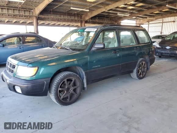 1999 Subaru Forester L with VIN JF1SF6355XG717440, listed as a Copart auction lot 65808265 with 374,544 mi miles and Salvage title. Bid and sale history available at DreamBid. Image 1.