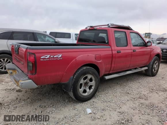 2004 Nissan Frontier SC with VIN 1N6MD29YX4C403429, listed as a Copart auction lot 43655135 with 105,282 mi miles and Salvage title. Bid and sale history available at DreamBid. Image 3.