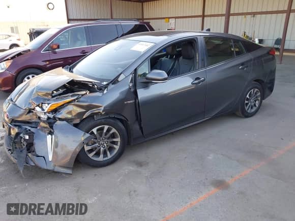 2022 Toyota Prius Nightshade with VIN JTDKAMFU4N3155017, listed as a IAAI auction lot 43013402 with 146,084 mi miles and . Bid and sale history available at DreamBid. Image 2.