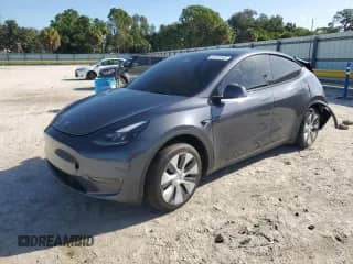 2023 Tesla Model Y with VIN 7SAYGDED8PF958853, listed as a Copart auction lot 67010345 with 54,767 mi miles and Salvage title. Bid and sale history available at DreamBid. Image 1.