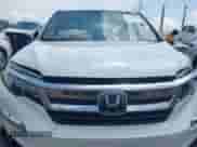 2021 Honda Pilot EX-L with VIN 5FNYF6H58MB075055, listed as a IAAI auction lot 42521760 with 59,336 mi miles and . Bid and sale history available at DreamBid. Image 12.