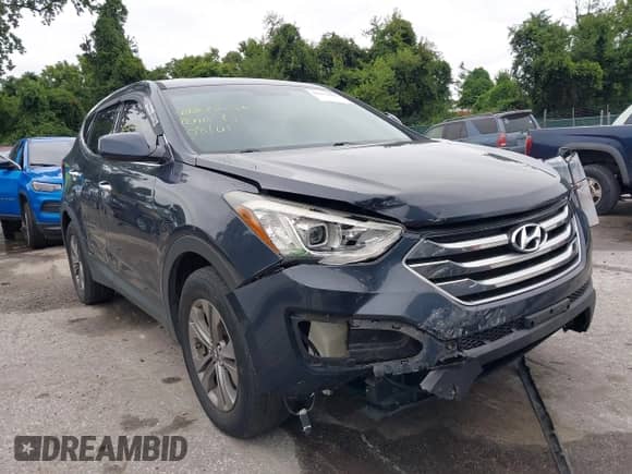 2015 Hyundai Santa Fe z VIN 5XYZTDLB8FG261026, wystawiony jako IAAI lot #42872886 z przebiegiem 146 244 mil mil oraz . Historia ofert i sprzedaży dostępna na DreamBid. Obrazek 6.