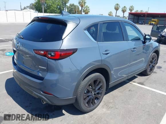 2022 Mazda CX-5 S Carbon Edition z VIN JM3KFBCM7N1601447, wystawiony jako IAAI lot #42463014 z przebiegiem 37 126 mil mil oraz . Historia ofert i sprzedaży dostępna na DreamBid. Obrazek 4.