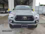 2021 Toyota Tacoma TRD Off Road with VIN 3TMCZ5AN5MM429356, listed as a Copart auction lot 71444135 with 68,728 mi miles and Salvage title. Bid and sale history available at DreamBid. Image 5.