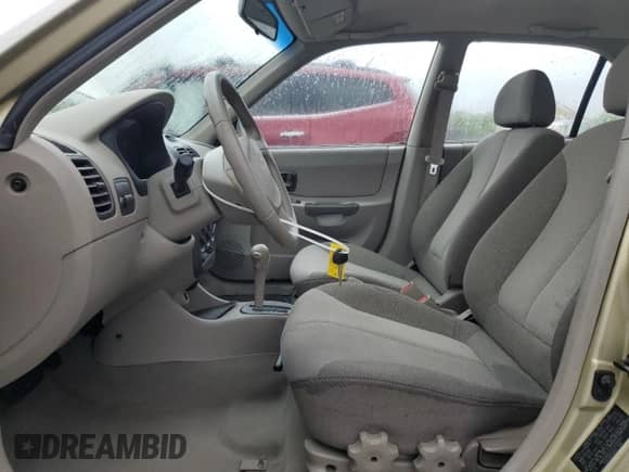 2002 Hyundai Accent GL z VIN KMHCG45C12U355561, wystawiony jako Copart lot #54546945 z przebiegiem 22 893 mil mil oraz Szkoda całkowita • Salvage title. Historia ofert i sprzedaży dostępna na DreamBid. Obrazek 7.