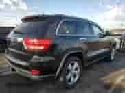 2012 Jeep Grand Cherokee Overland z VIN 1C4RJFCG2CC252898, wystawiony jako Copart lot #80726185 z przebiegiem 91 276 mil mil oraz Szkoda całkowita • Salvage title. Historia ofert i sprzedaży dostępna na DreamBid. Obrazek 3.