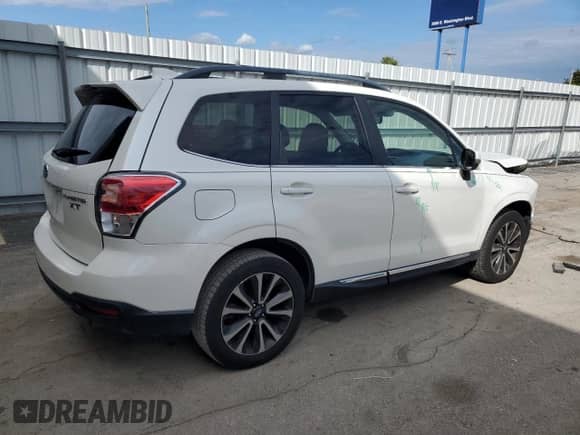 2017 Subaru Forester Touring z VIN JF2SJGWCXHH453105, wystawiony jako Copart lot #70501345 z przebiegiem 146 190 mil mil oraz Szkoda całkowita • Salvage title. Historia ofert i sprzedaży dostępna na DreamBid. Obrazek 3.