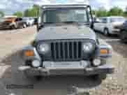 2001 Jeep Wrangler SE with VIN 1J4FA29P41P355548, listed as a Copart auction lot 56214205 with 173,125 mi miles and Clean title. Bid and sale history available at DreamBid. Image 5.