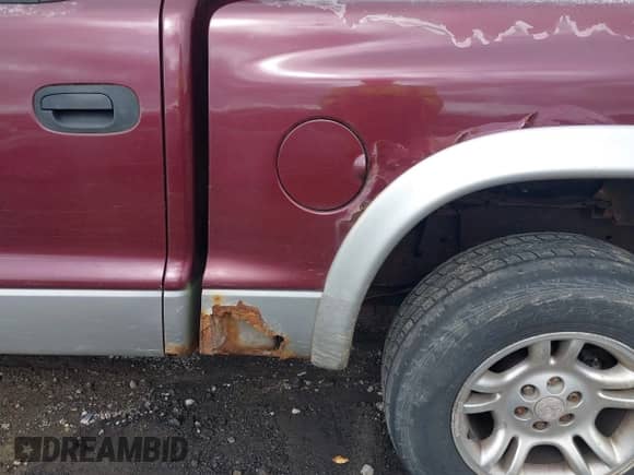 2003 Dodge Dakota SLT z VIN 1D7HG48N43S134367, wystawiony jako IAAI lot #43455942 z przebiegiem 220 079 mil mil oraz . Historia ofert i sprzedaży dostępna na DreamBid. Obrazek 13.