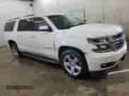 2015 Chevrolet Suburban LT with VIN 1GNSKJKC6FR635316, listed as a Copart auction lot 65336185 with 217,006 mi miles and Salvage title. Bid and sale history available at DreamBid. Image 4.