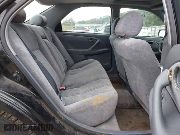 1997 Toyota Camry LE z VIN 4T1BF22K0VU908199, wystawiony jako IAAI lot #43395259 z przebiegiem 165 234 mil mil oraz . Historia ofert i sprzedaży dostępna na DreamBid. Obrazek 8.