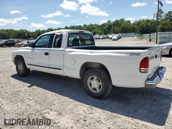1999 Dodge Dakota SLT z VIN 1B7GL22X2XS114639, wystawiony jako Copart lot #61749075 z przebiegiem 135 191 mil mil oraz Szkoda całkowita • Salvage title. Historia ofert i sprzedaży dostępna na DreamBid. Obrazek 2.